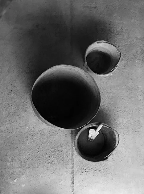 alc-diseno-autor-03-cubos Tres cubos de obra vistos desde arriba sobre una solera de hormigón